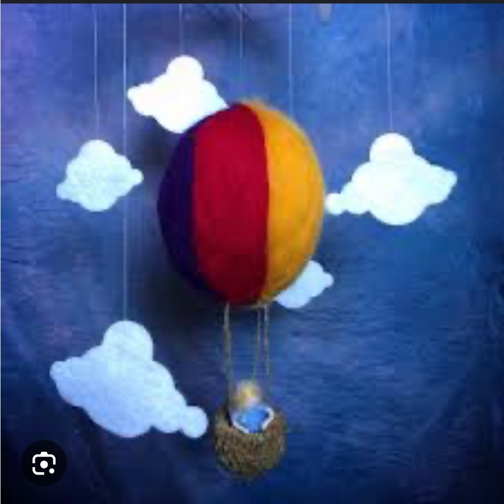 Waldorf style mobile girl in hot air balloon and clouds